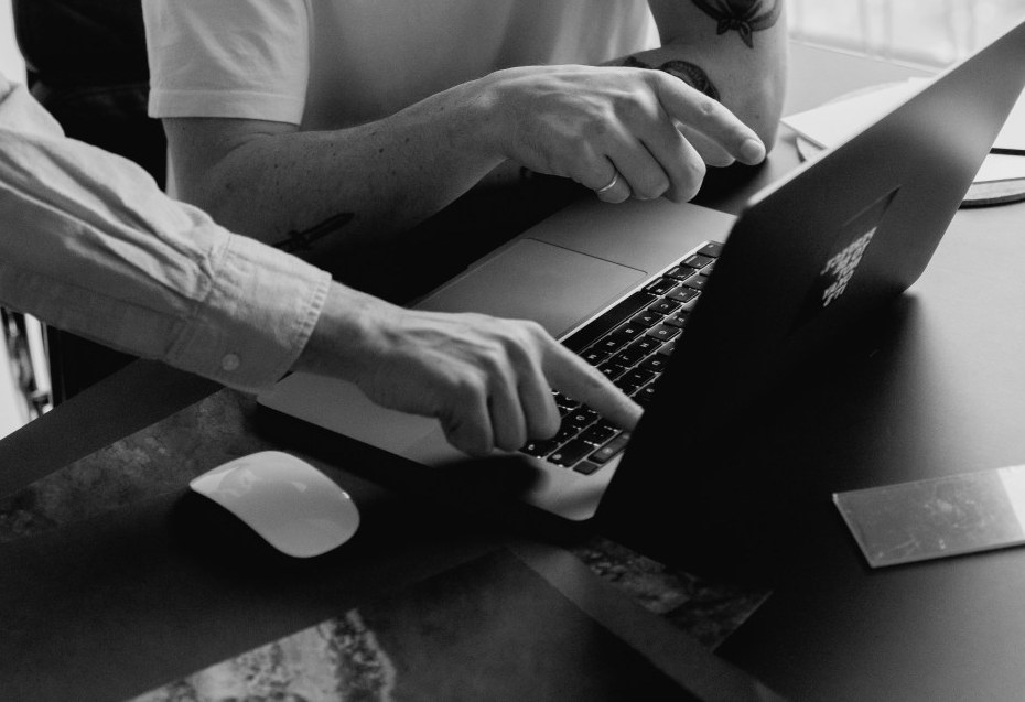 Working through a task together on a laptop